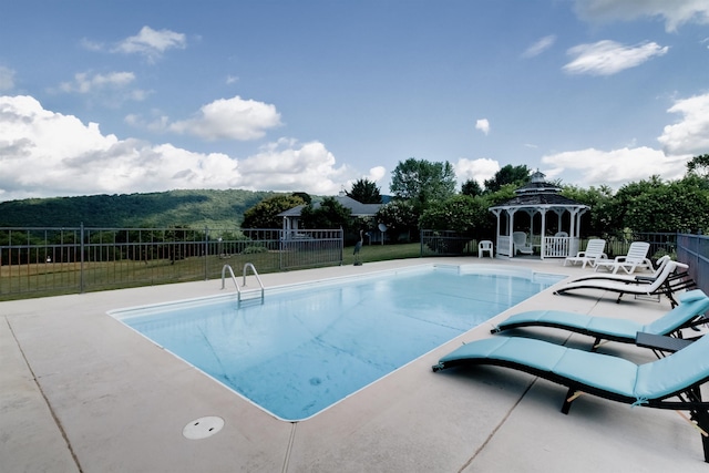 view of pool featuring a gazebo and a patio area