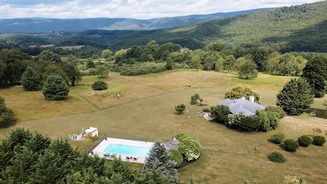 drone / aerial view with a mountain view and a rural view