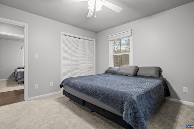 carpeted bedroom featuring a ceiling fan, baseboards, and a closet