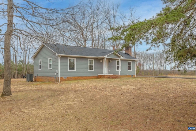 ranch-style house featuring a shingled roof, central AC unit, a chimney, and crawl space