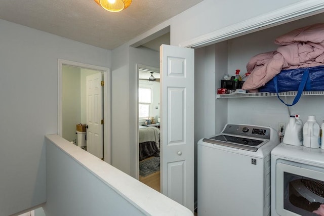 laundry room featuring laundry area and washer and clothes dryer