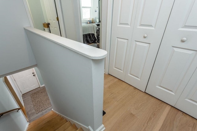 hallway with light wood finished floors