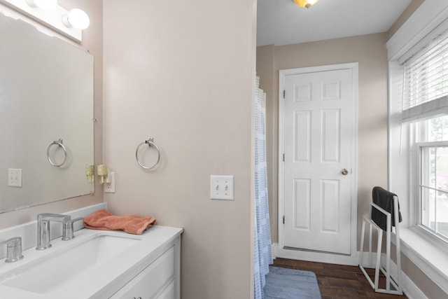full bath featuring vanity and wood finished floors