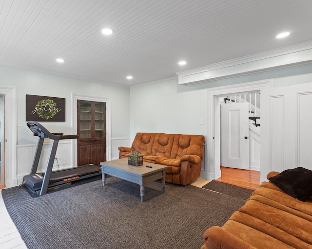 living area featuring crown molding, a wainscoted wall, recessed lighting, wood finished floors, and wood ceiling