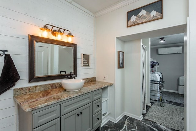 full bath with a wall mounted air conditioner, vanity, baseboards, marble finish floor, and ornamental molding