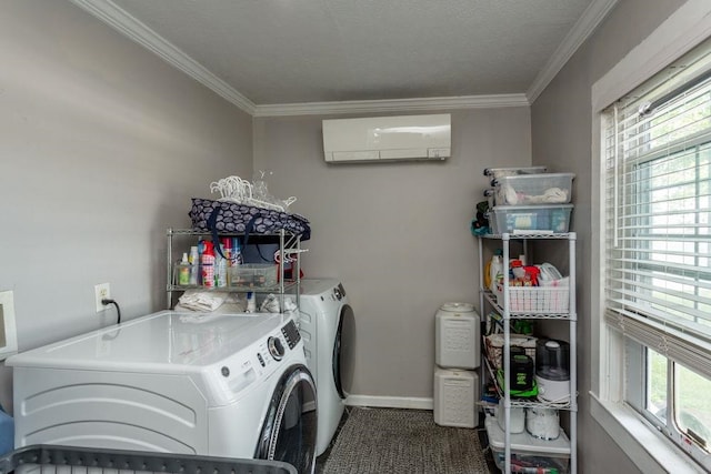 clothes washing area with independent washer and dryer, laundry area, crown molding, and baseboards