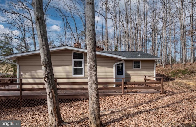 view of home's exterior with a wooden deck