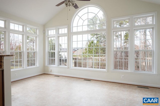 unfurnished sunroom featuring vaulted ceiling, visible vents, and ceiling fan