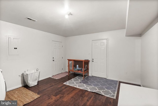 entrance foyer featuring dark hardwood / wood-style flooring and electric panel