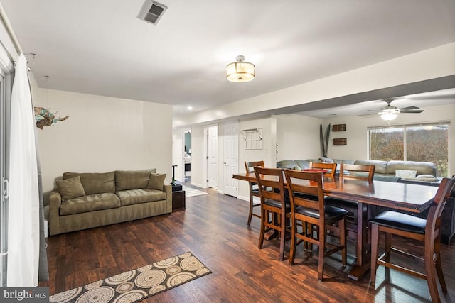 dining area featuring ceiling fan and dark hardwood / wood-style flooring