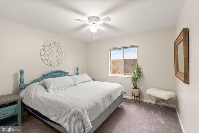 bedroom featuring dark colored carpet and ceiling fan