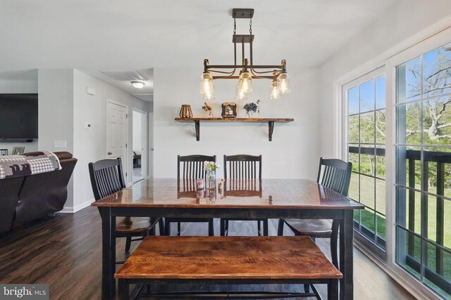 carpeted home office featuring baseboards