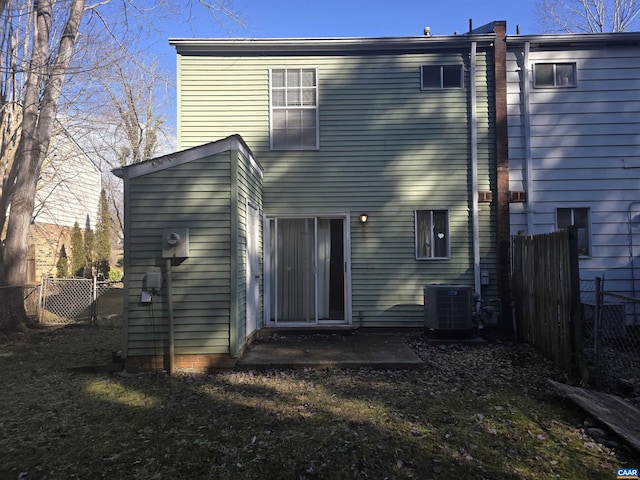 back of property featuring central AC unit and a patio