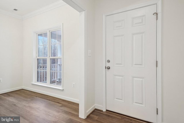 entrance foyer featuring hardwood / wood-style flooring and crown molding