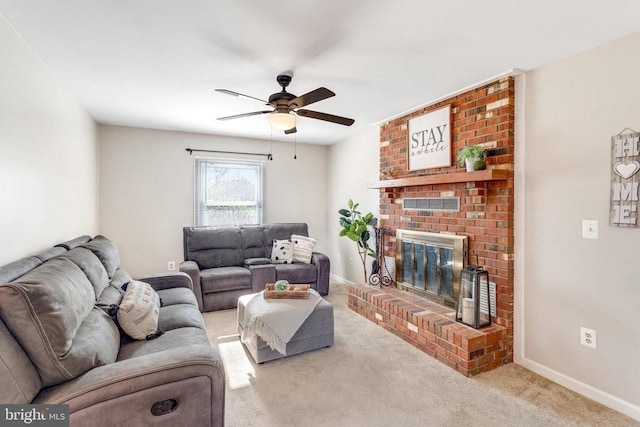 carpeted living room with a fireplace, a ceiling fan, and baseboards