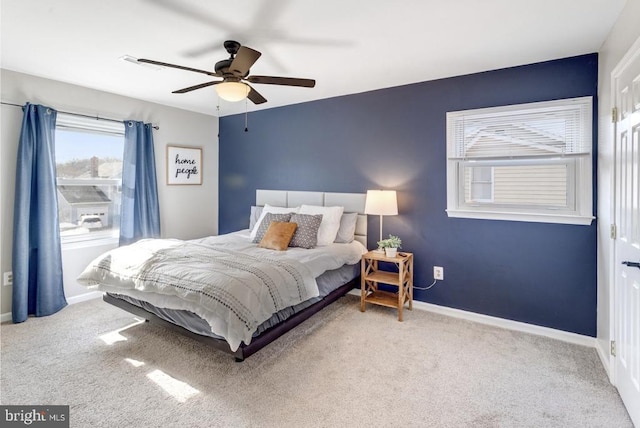 bedroom with carpet, baseboards, and ceiling fan