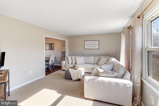 living room with carpet flooring and baseboards