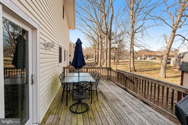 wooden deck featuring outdoor dining space