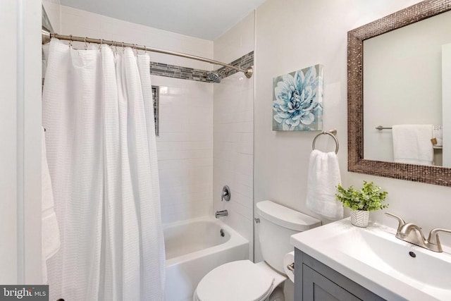 full bath featuring vanity, toilet, and shower / tub combo with curtain