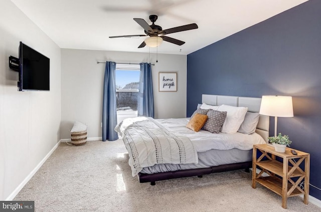 bedroom with a ceiling fan, baseboards, and carpet floors