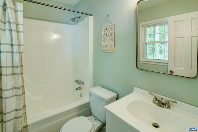 full bathroom with vanity, shower / bath combination with curtain, and toilet
