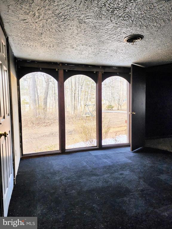 interior space with a textured ceiling