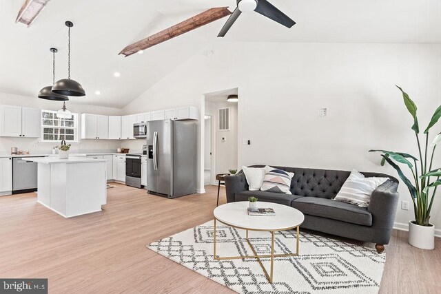 living room with beam ceiling, high vaulted ceiling, ceiling fan, and light wood-type flooring