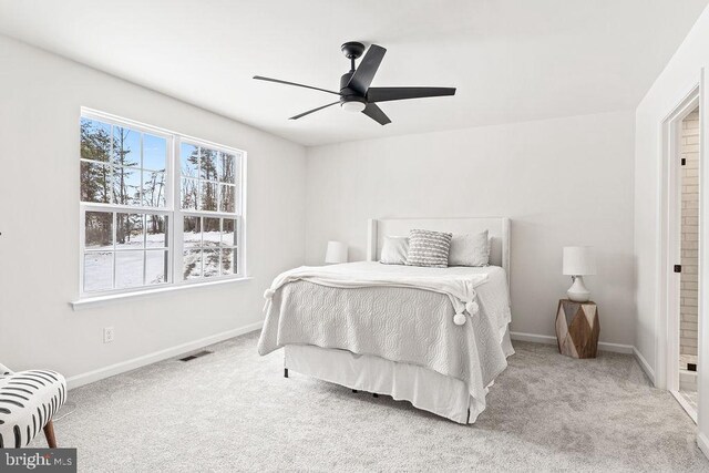 bedroom with light colored carpet and ceiling fan