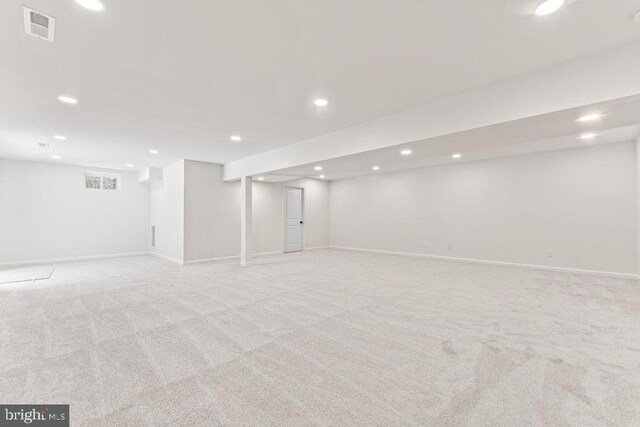 basement with light colored carpet