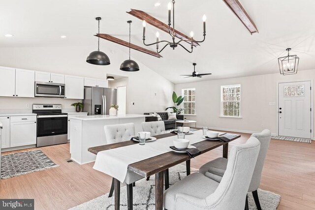 dining room featuring beamed ceiling, high vaulted ceiling, ceiling fan, and light hardwood / wood-style flooring