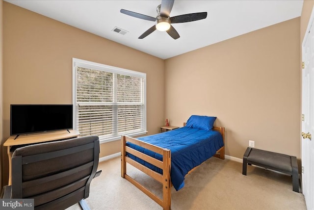 bedroom with a ceiling fan, baseboards, visible vents, and carpet flooring