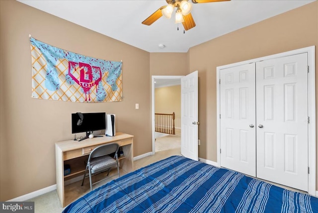 bedroom with carpet floors, a ceiling fan, baseboards, and a closet