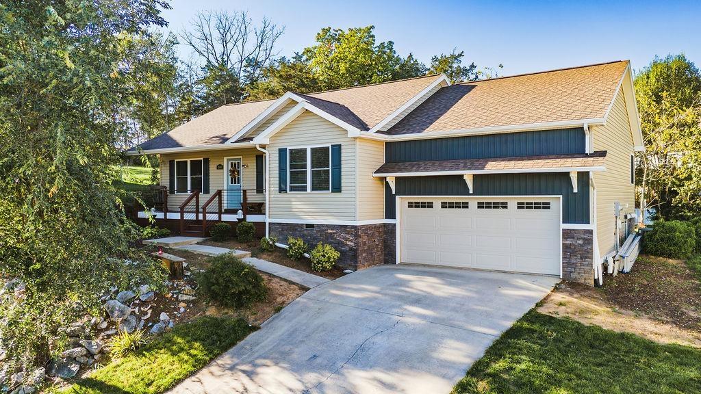 view of front of property with a garage and covered porch