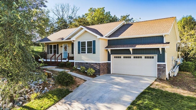 view of front of property with a garage and covered porch