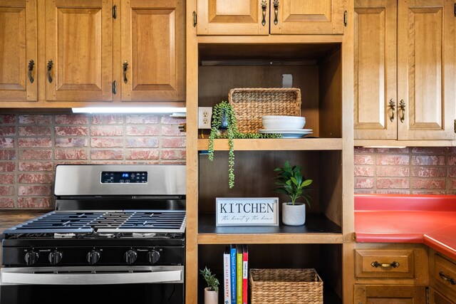 kitchen featuring tasteful backsplash and range with gas stovetop