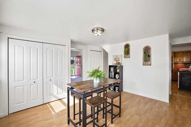 dining area with light hardwood / wood-style flooring