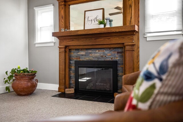 details with a stone fireplace