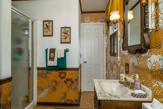 bathroom featuring walk in shower, vanity, and a textured ceiling