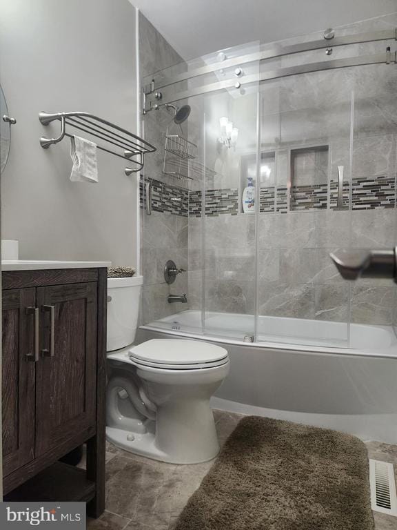 full bathroom with combined bath / shower with glass door, visible vents, toilet, and vanity