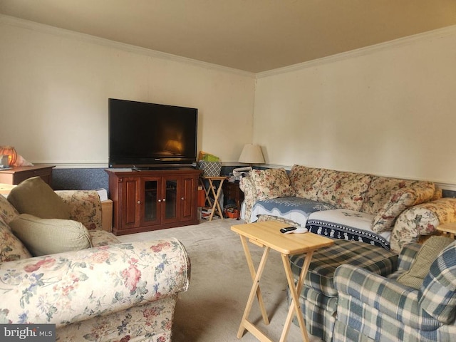 living area featuring ornamental molding and light carpet