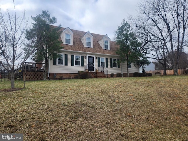 cape cod home featuring crawl space, roof with shingles, a front yard, and fence