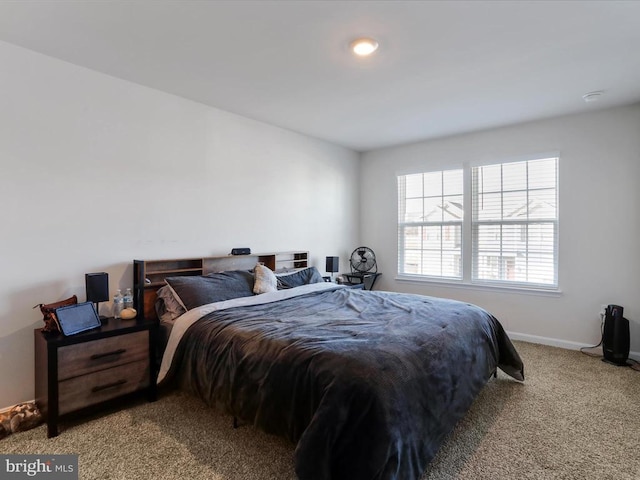 bedroom with light colored carpet