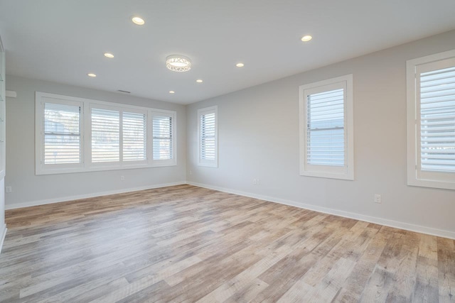 spare room with light hardwood / wood-style floors