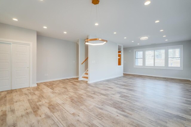 unfurnished living room with light hardwood / wood-style floors