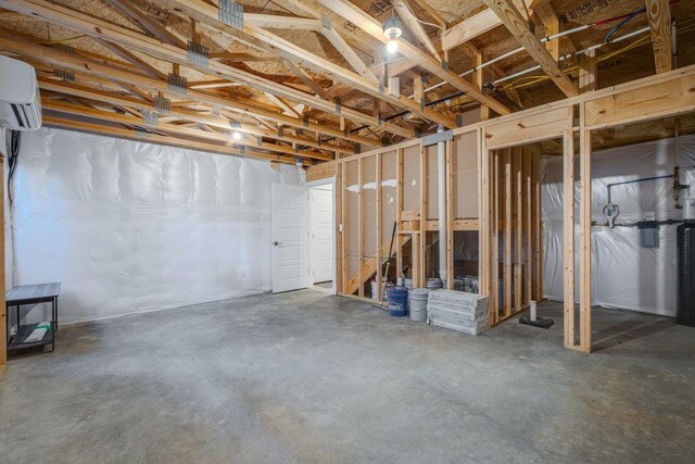 basement featuring a wall unit AC