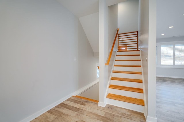 stairs with hardwood / wood-style flooring