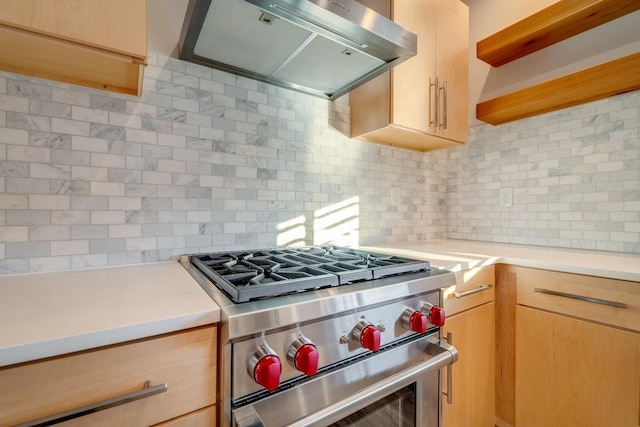 kitchen with decorative backsplash, high end stainless steel range, range hood, and light brown cabinets