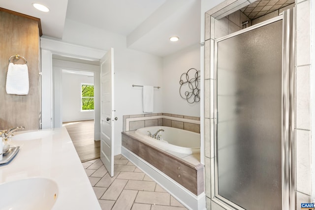 bathroom with a shower stall, baseboards, recessed lighting, a bath, and tile patterned flooring