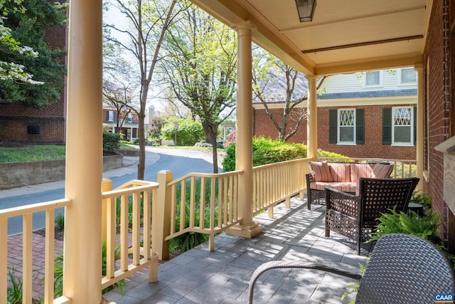view of patio with outdoor lounge area and covered porch