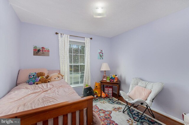 bedroom featuring hardwood / wood-style floors